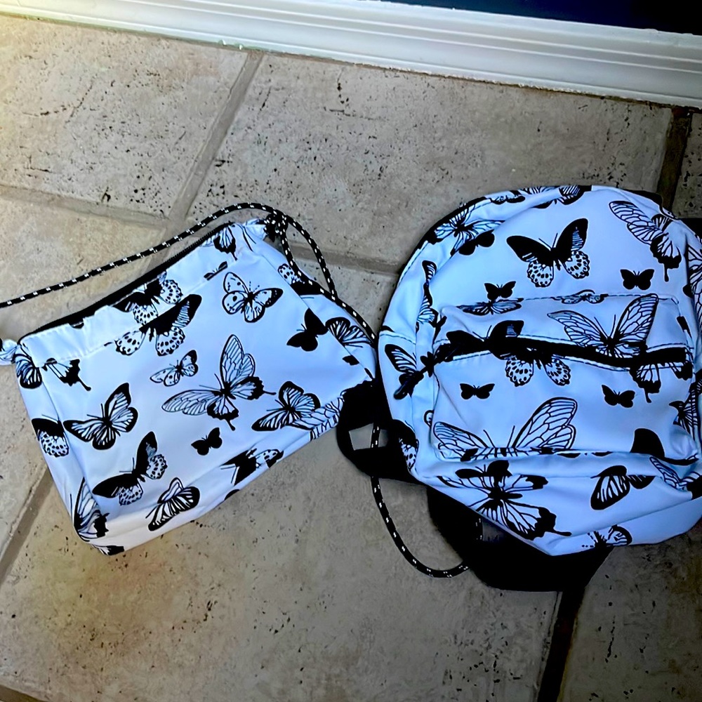 Blue, black and white butterfly purse, and backpack set